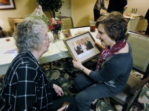 Congresswoman Bonamici admiring Granny's photo with Mondale and Carter